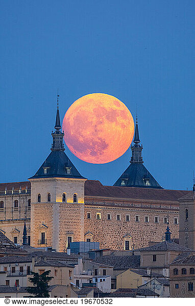 Full moon at historical castle Alcazar in old town