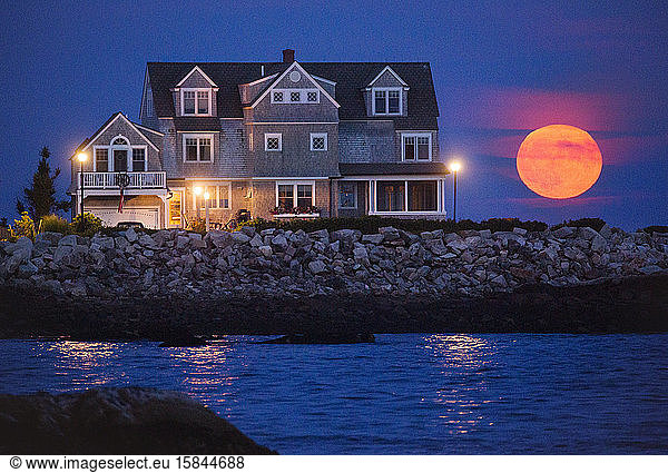 Full moon behind house at Biddeford Pool  Maine