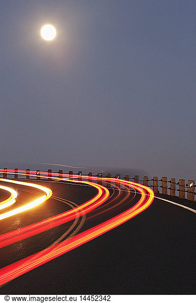 Full Moon Over a Curving Road