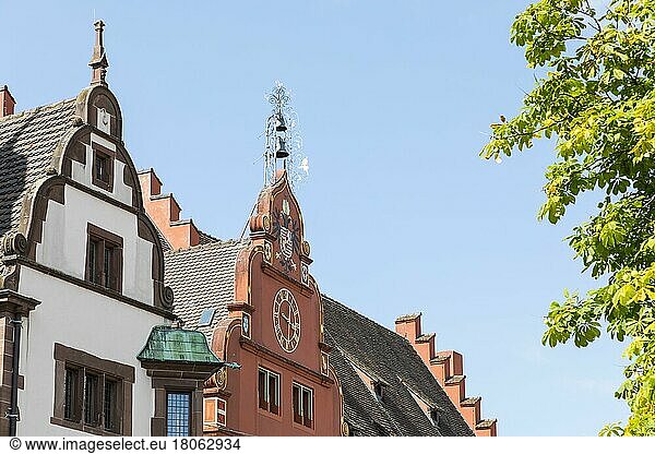 Gables of the New Town Hall and the Old Town Hall with coat of arms  clock and bell tower  Rathausplatz in Freiburg im Breisgau  Baden-Württemberg  Germany  Europe
