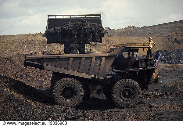 GABON Moanda Loading large truck at manganese mine.