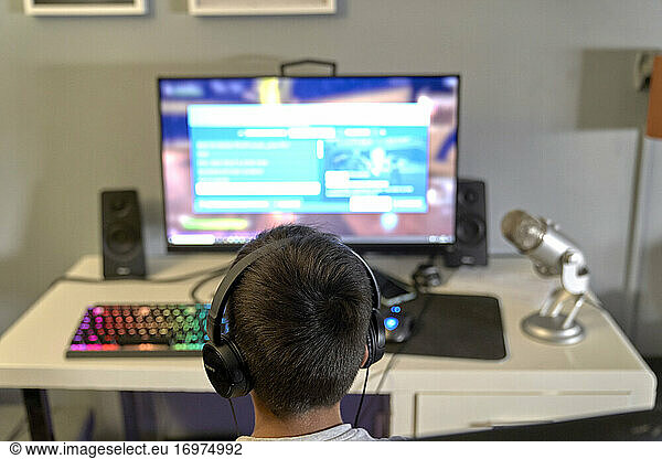 Gamer kid playing video games