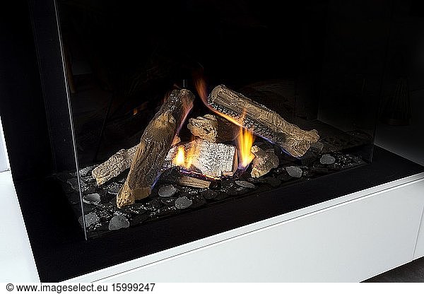 Gas fireplace with white mantel modern interior luxury design  close-up in a modern home beauty.
