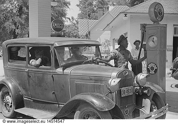 Gas Station Attendant Filling Car with Gasoline  Atlanta  Georgia  USA  Marion Post Wolcott for Farm Security Administration  June 1939
