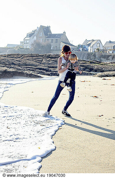 Gaspard Launay and his Mom having fun on the Beach.