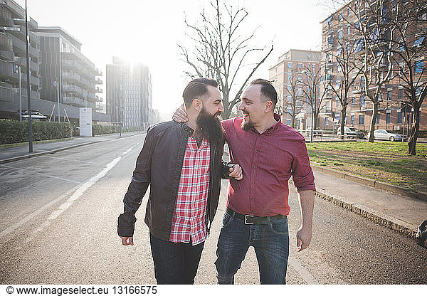 Gay couple walking on street
