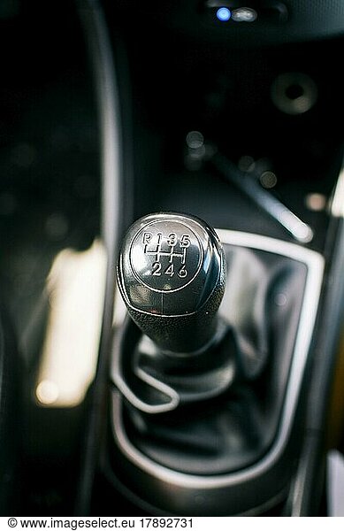 Gear lever of a vehicle. Close up of a car gear lever  Close up of a car gear knob. Detail view of a vehicle transmission lever