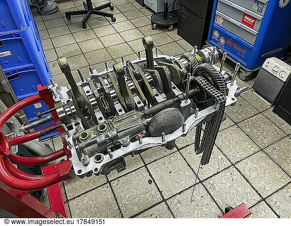 Gearbox for air-cooled engine of historic classic sports car classic car Porsche 911 964 overhauled restored in workshop on rack for assembly assembly rack  Germany  Europe