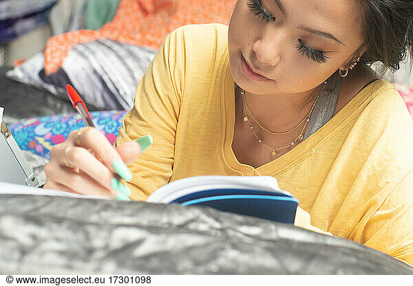 Gen Z writing in her journal