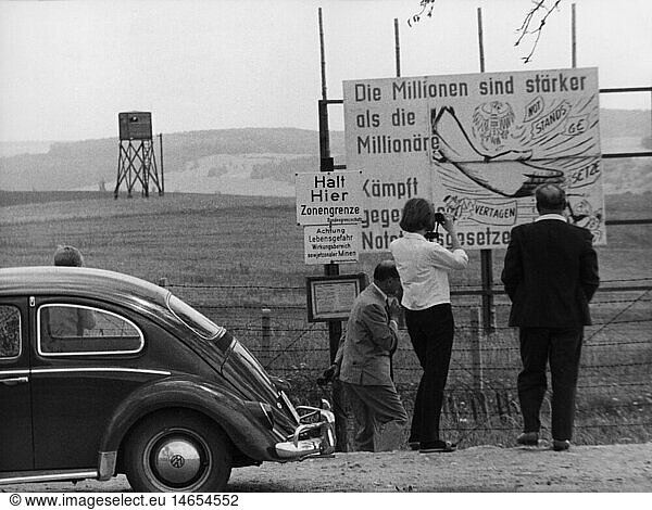 Geo. hist.  Deutschland  Grenzen  Innerdeutsche Grenze  Ostdeutsche Propaganada  Schild 'Die Millionen sind stÃ¤rker als die MillionÃ¤re'  HohegeiÃŸ im Harz  20.9.1965