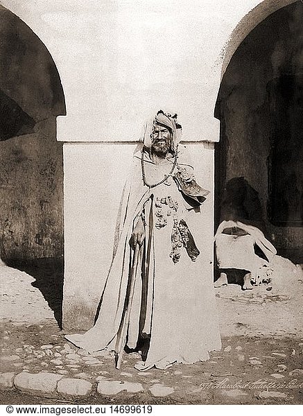 geography / travel  Algeria  people  men  Marabout (Muslim religious leader) in Biskra  full length  late 19th century  historic  historical  North Africa  Northern Africa  religion  religions  Islam  Moslem  Muslim  Moslems  Muslims  Suliette  Marabou  man  men  jewellery  jewelry  cane  stick  beards  full beard  holy  male