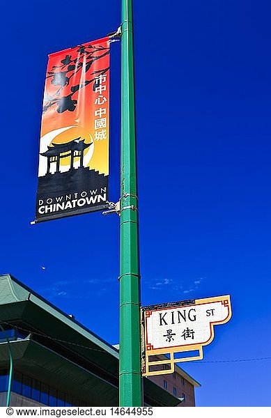 geography / travel  Canada  Manitoba  Winnipeg  Banner and street sign on a post in Chinatown  City of Winnipeg  Manitoba