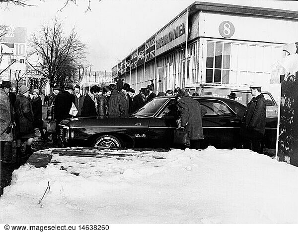 geography / travel  East Germany  trade  Leipzig spring fair 1970  visitors gazing at a foreign car  8.3.1970  people  Saxony  Leipzig district  Central Europe  1960s  60s  20th century  historic  historical  1970s