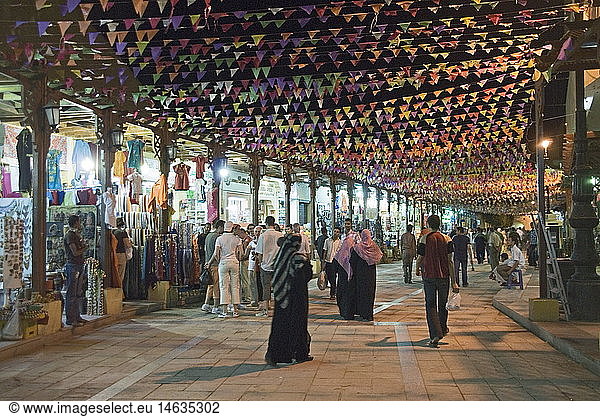geography / travel  Egypt  Aswan  bazar  Sharia el-Suk (market street)  pedestrians  evening