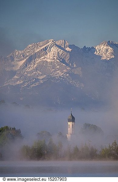 geography / travel  Germany  Bavaria  Riegsee  Riegsee and church Froschhausen outside of Wetterstein mountain range with Alpspitze (peak)  Upper Bavaria  Southern Germany