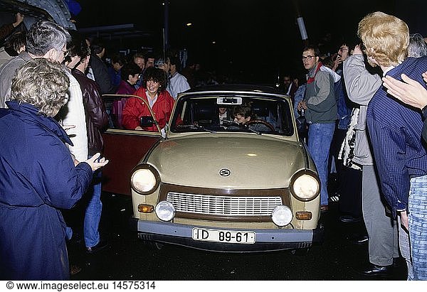 geography / travel  Germany  Fall of the Berlin Wall  GDR citizen in Trabant car at checkpoint  Berlin  November 1989  historic  historical  20th century  1980s  80s  opening  down  night  people  celebrating  happy  greeting  welcome  welcoming  November'89  November 89  woman  women  female