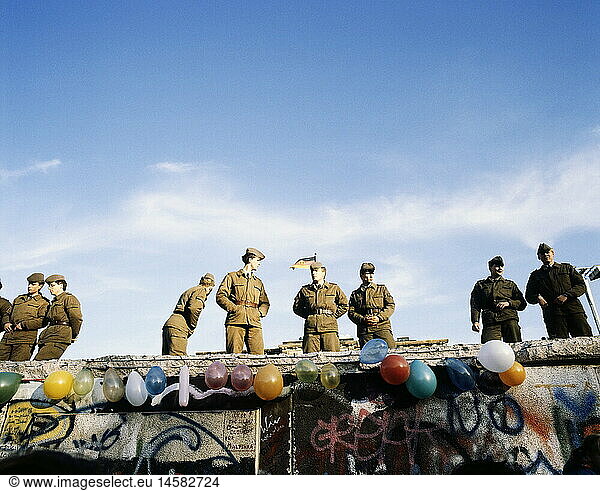 geography / travel  Germany  Fall of the Berlin Wall  soldiers standing on the Wall  in front of the Brandenburg Gate  Berlin  December 1989  historic  historical  20th century  1980s  80s  opening  down  November'89  November 89  East Germany  East-Germany  German border  NVA border patrol  soldier  people  male  man  men
