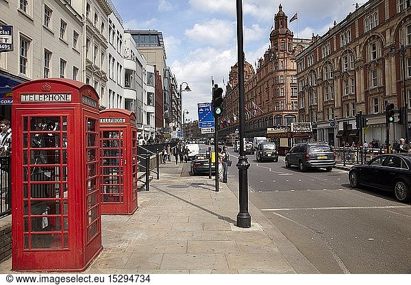 Geography / travel  Great Britain  England  Phone Box  and Harrods Department Store  Brompton Road  London  United Kingdom