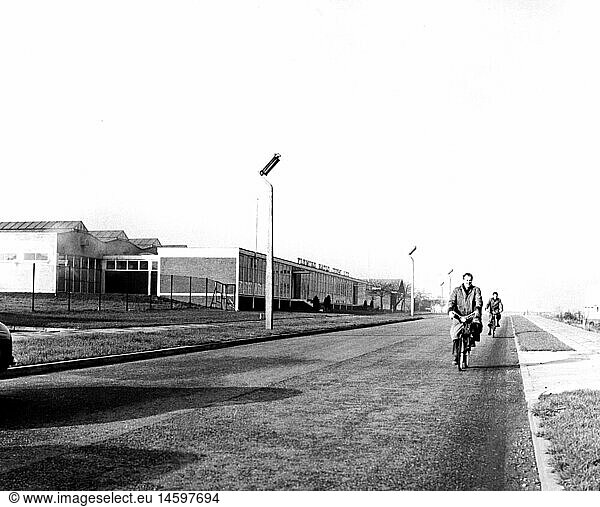 geography / travel  Great Britain  Stevenage  street scenes  cyclist on street in industrial centre  1960s
