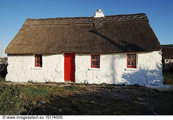 geography / travel  Ireland  County Galway  Thatched cottage with red door  near Rossaveel  Connemara  County Galway  Connaught.