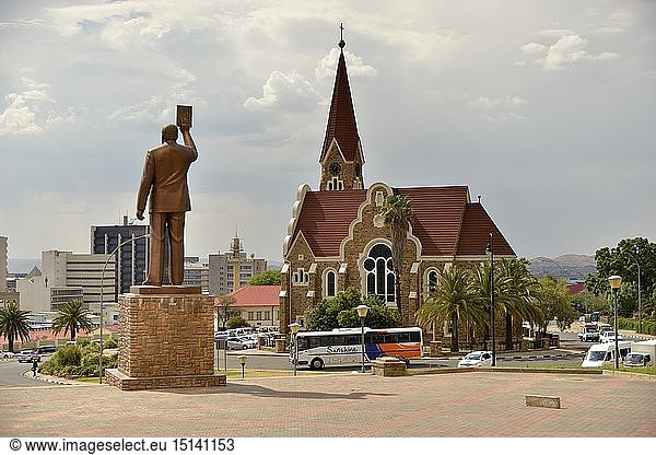 geography / travel  Namibia  statue of Sam Nujoma  chief president of the republic  in front of the new Independence Memorial Museum  Independence Memorial Museum  the Christ Church from 1910  Windhoek  Namibia