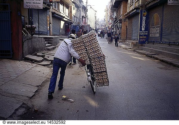 geography / travel  Nepal  people  man transporting egg palettes on bicycle  Kathmandu
