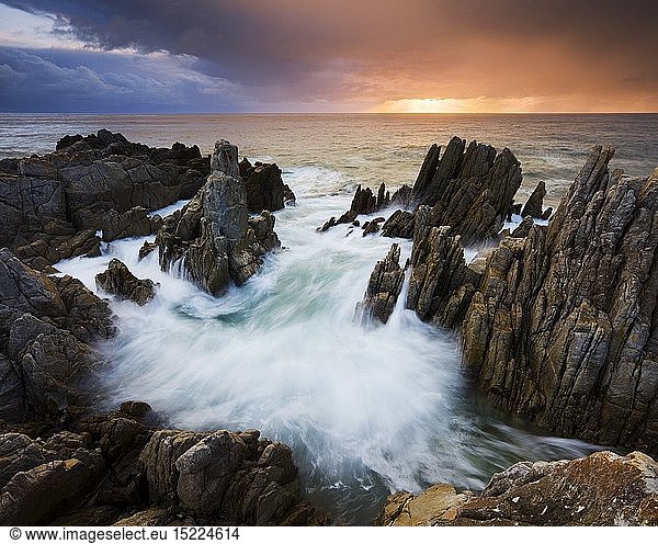 geography / travel  South Africa  Landscape of a dramatic sunset on a rocky coastline. De Kelders  Western Cape