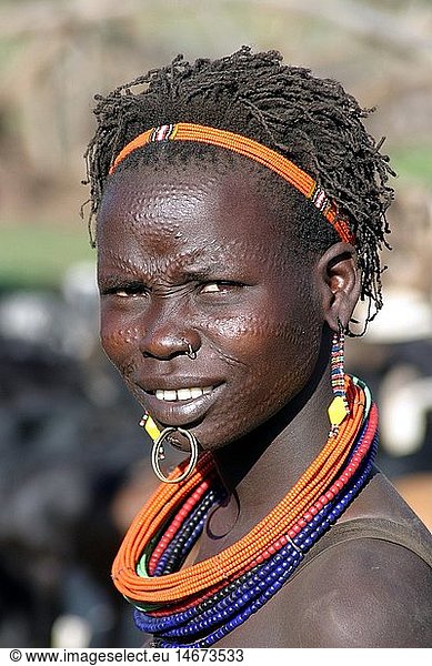 geography / travel  South Sudan  people  women  Toposa woman with headdress  necklace and scars as jewellery in the face  portrait  near Nyanyagachor