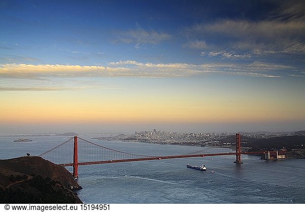 geography / travel  USA  California  San Francisco  Dusk over the Golden Gate bridge and San Francisco bay seen from Hawk Hill  with the town of San Francisco in the background