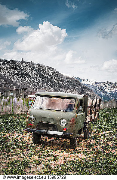 Georgia  Svaneti  Ushguli  Old truck parked in front of mountain village
