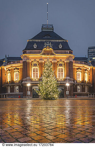 Germany,  Hamburg,  Laeiszhalle concert hall with Christmas tree illuminated at night
