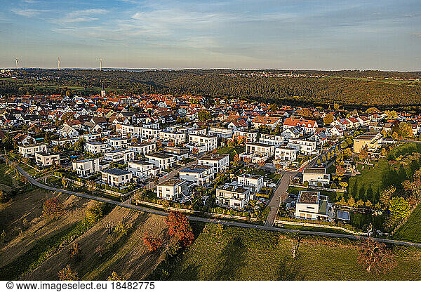 Germany  Baden-Wurttemberg  Baltmannsweiler  Aerial view of modern suburb at autumn dusk