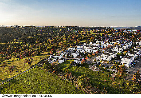 Germany  Baden-Wurttemberg  Baltmannsweiler  Aerial view of modern suburb at autumn dusk