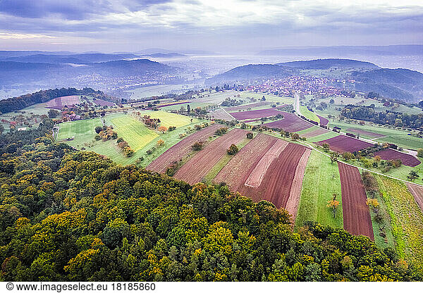 Germany  Baden-Wurttemberg  Drone view of fields in Remstal valley at foggy dawn