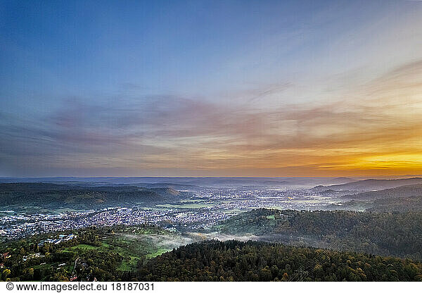 Germany  Baden-Wurttemberg  Drone view of town in Remstal valley at foggy dawn