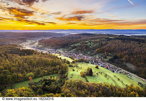 Germany  Baden-Wurttemberg  Drone view of village in Nassachtal valley at autumn dawn