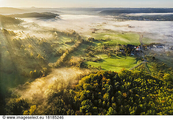 Germany  Baden-Wurttemberg  Drone view of Wieslauftal valley shrouded in thick autumn fog at dawn