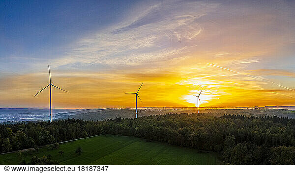 Germany  Baden-Wurttemberg  Drone view of wind farm in Remstal valley at sunrise