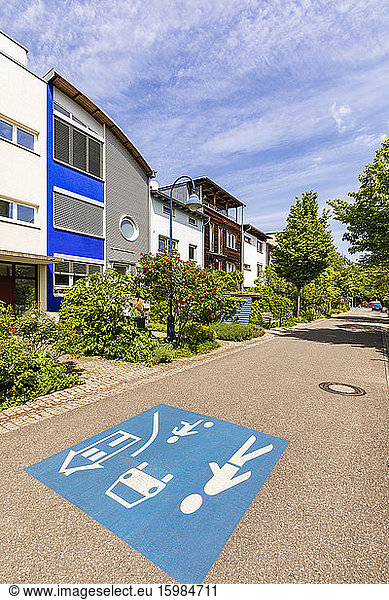 Germany  Baden-Wurttemberg  Freiburg im Breisgau  Children at play road marking in modern suburb