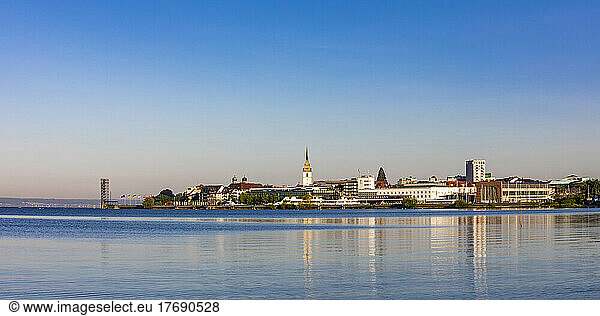 Germany  Baden-Wurttemberg  Friedrichshafen  Panoramic view of town on shore of Lake Constance at dusk