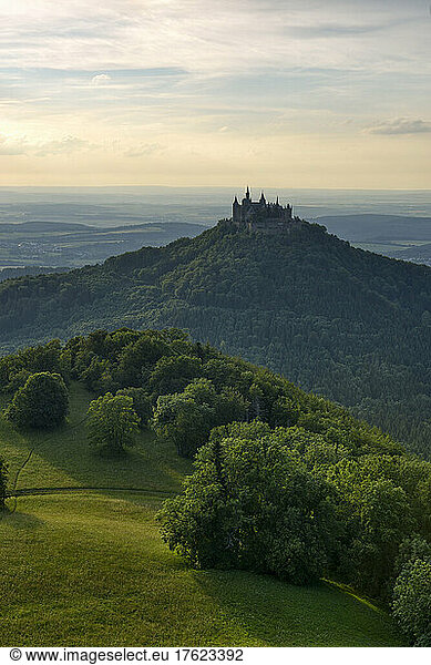 Germany  Baden-Wurttemberg  Hechingen  View of forested Hohenzollern mountain at summer dusk