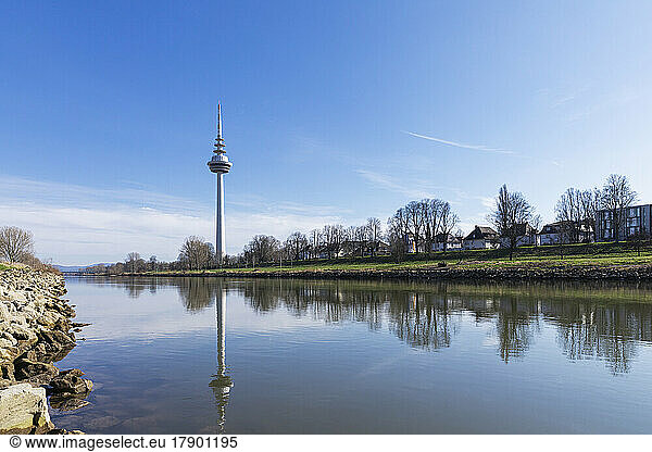 Germany  Baden-Wurttemberg  Mannheim  Neckar River flowing through Luisenpark with TV tower in background