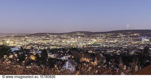 Germany  Baden-Wurttemberg  Stuttgart  Clear sky over illuminated city downtown at dusk