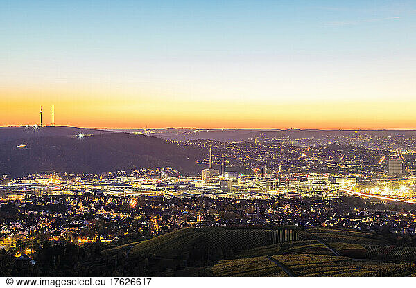 Germany  Baden-Wurttemberg  Stuttgart  Long exposure of illuminated Bad Cannstatt borough at dusk