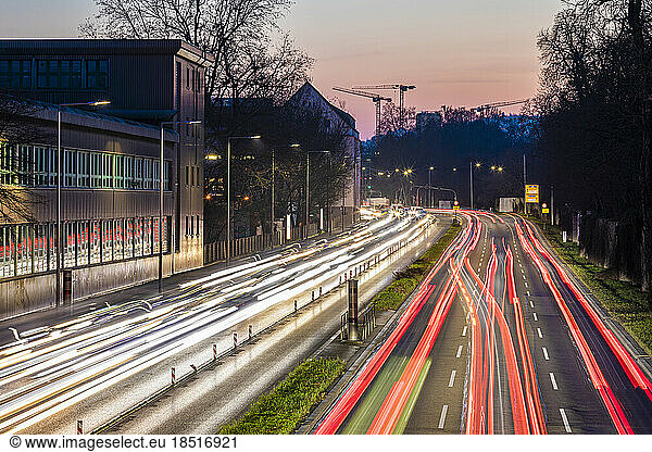 Germany  Baden-Wurttemberg  Stuttgart  Long exposure of traffic jam on multiple lane highway at dusk