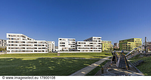 Germany  Baden-Wurttemberg  Ulm  Modern suburban apartments with public playground in foreground