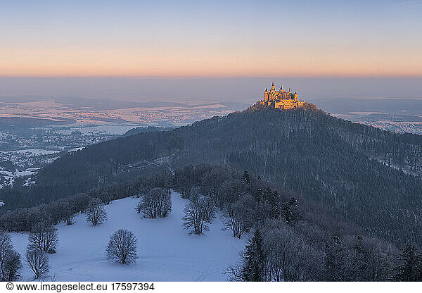 Germany  Baden-Wurttemberg  View of Hohenzollern mountain and castle at winter dawn