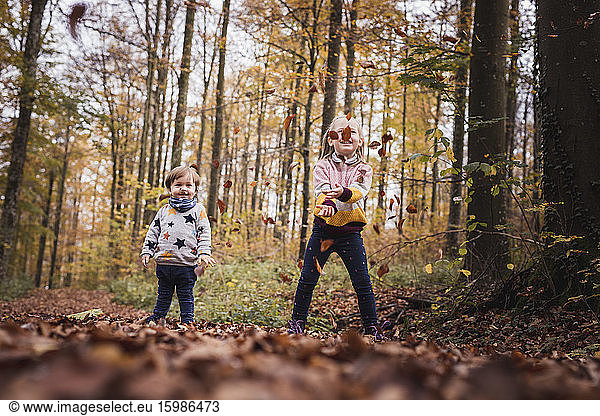 Germany  Baden-Wurttenberg  Lenningen  Two children playing in autumn forest