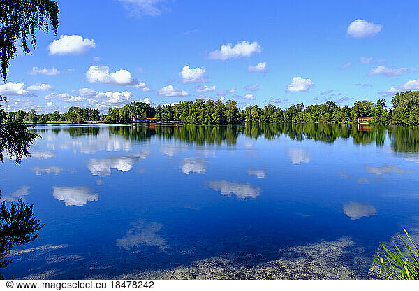 Germany  Bavaria  Clouds reflecting in Waldschwaigsee lake