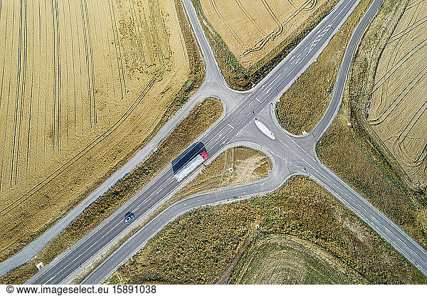 Germany  Bavaria  Drone view of road intersection between countryside fields in summer
